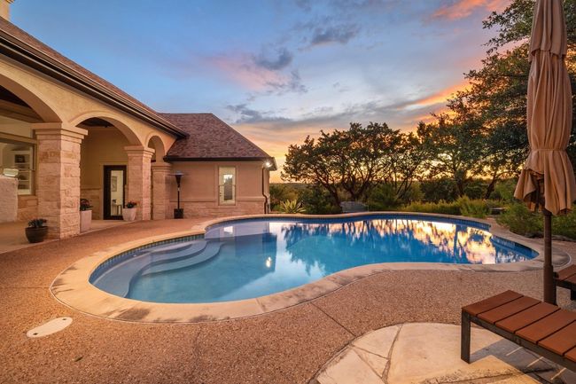 Pool at dusk featuring an outdoor pool and a patio | Image 31