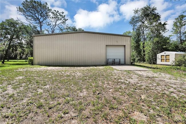 Back side of hangar with nice utility shed to the right of it | Image 27