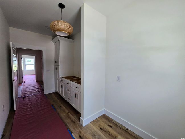 Corridor featuring wood finished floors and baseboards | Image 19