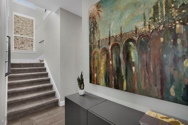 Staircase with wood finished floors and baseboards | Image 17