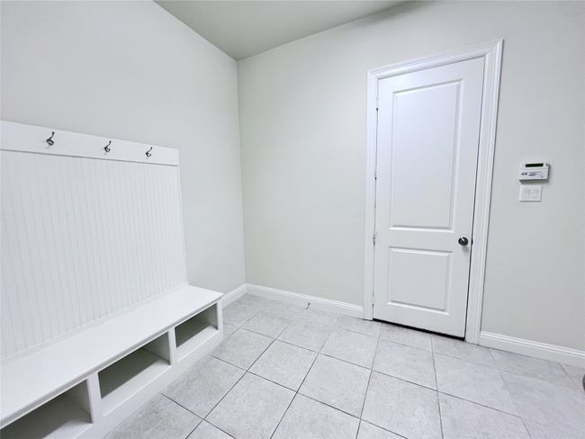 Mudroom with light tile patterned floors | Image 24