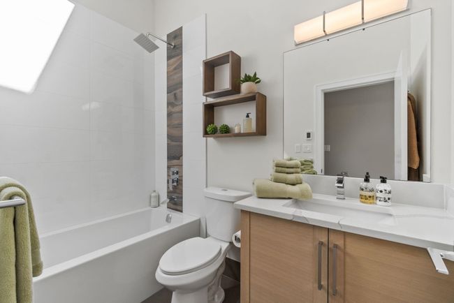 Full bathroom featuring vanity, tub / shower combination, and toilet | Image 15