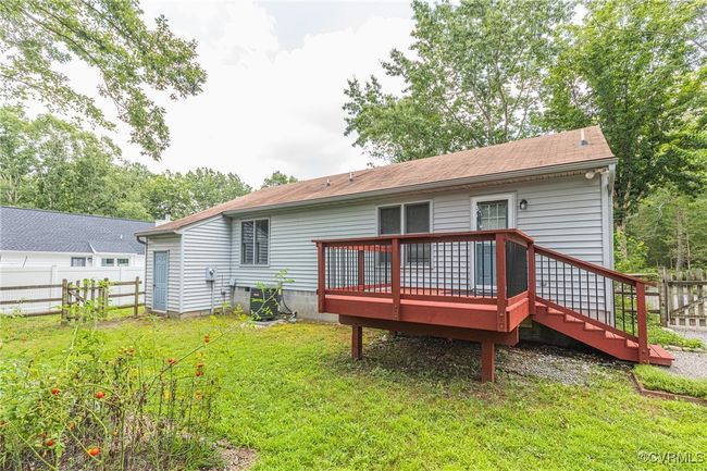 Back of house with a wooden deck and a shingled roof | Image 31