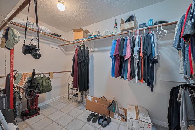 Large walk-in closet in the primary suite offers ample storage and the opportunity to customize the space to fit your needs. | Image 18