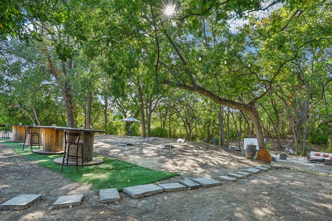 View of yard featuring view of wooded area | Image 38