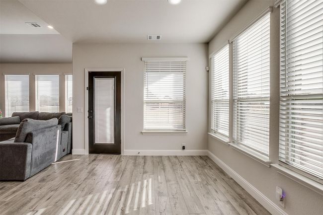 Entryway featuring light hardwood / wood-style flooring and a wealth of natural light | Image 6