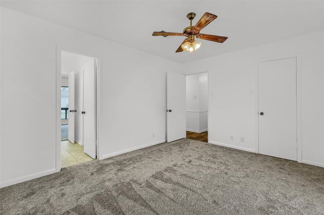 Unfurnished bedroom featuring carpet floors and baseboards | Image 17