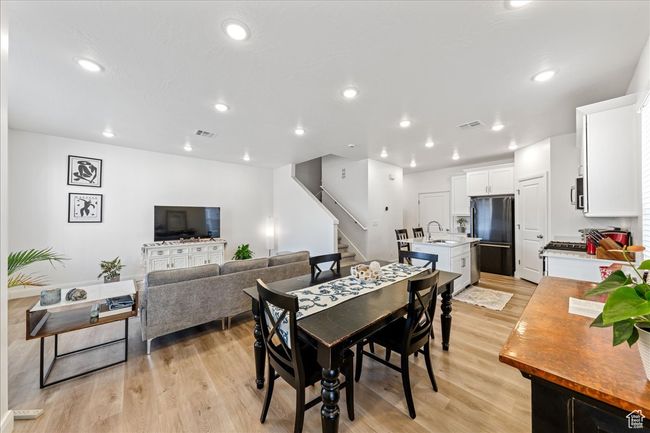 Dining area featuring stairway, light wood-style flooring, and recessed lighting | Image 12