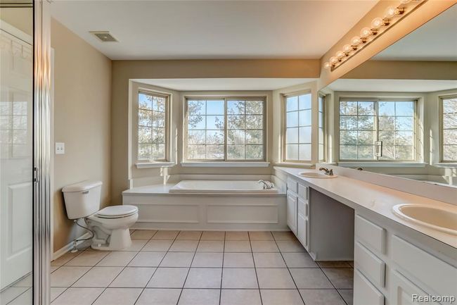 Large garden window over the jetted tub in the jack and jill bath. | Image 16