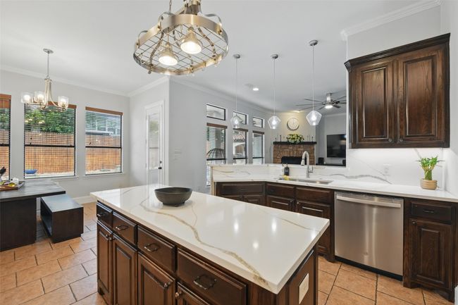 Nice sized kitchen island with electric outlets. | Image 13