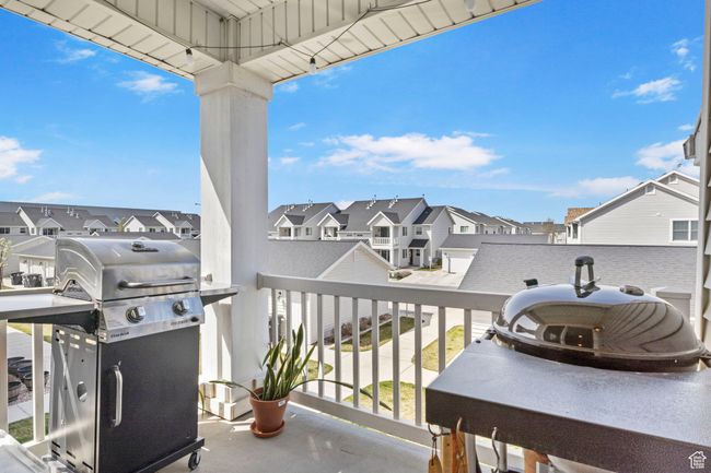Balcony with grilling area and a residential view | Image 8