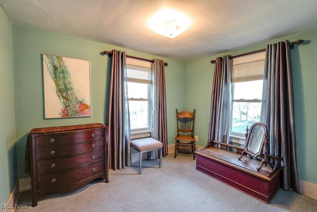 Bedroom with baseboards, light carpet, and plenty of natural light | Image 21