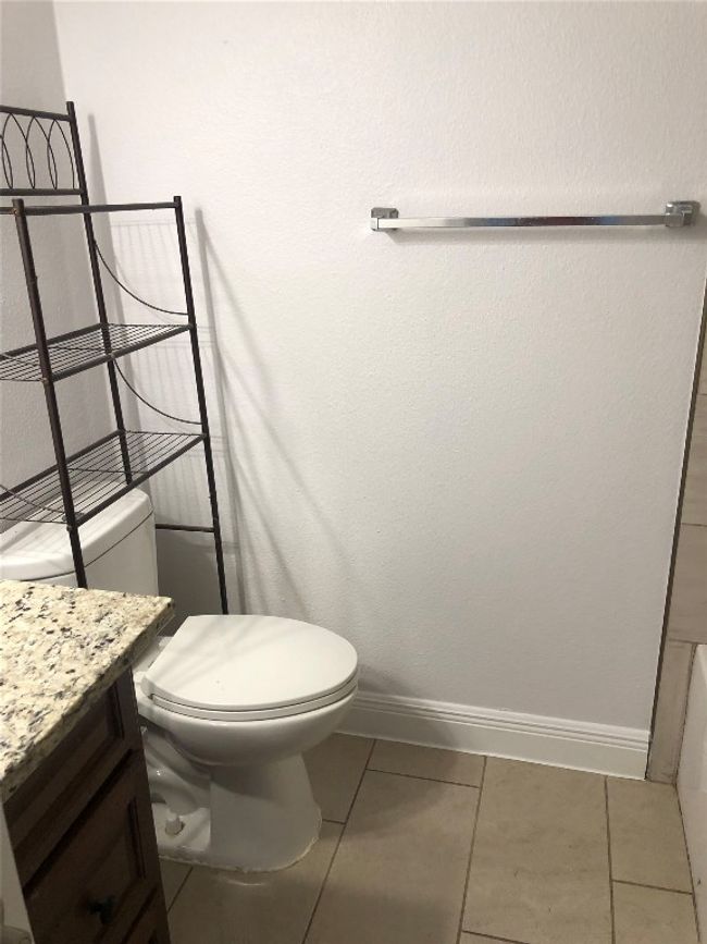 Bathroom featuring vanity and tile patterned floors | Image 16