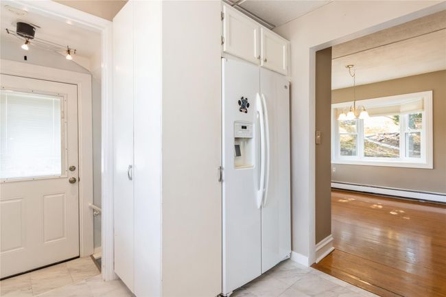 The kitchen has a door to the patio. | Image 4