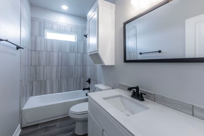 Full bathroom featuring vanity and shower / washtub combination | Image 19
