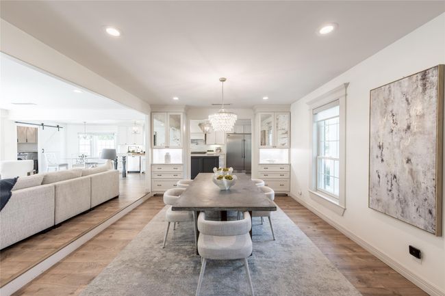 The dining room, measuring 20x13, is perfectly located with easy access to kitchen and living room. Beautiful built-ins for extra storage. | Image 7