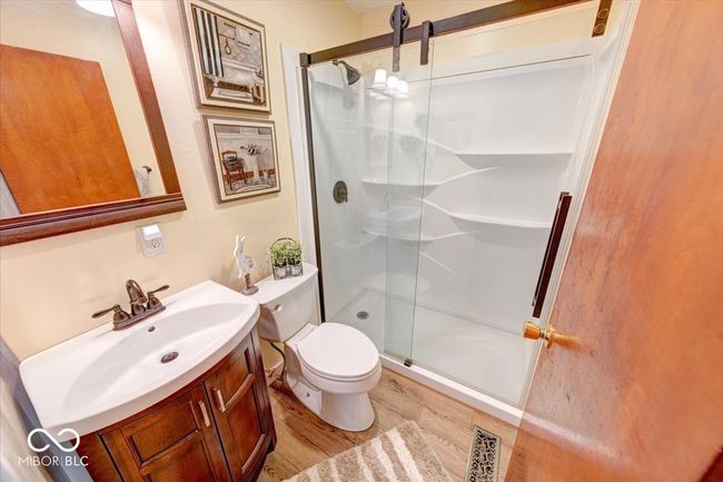 hallway full bathroom is updated with a shower stall | Image 35