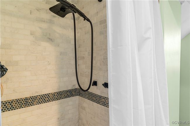 Full bathroom featuring a tile shower | Image 22