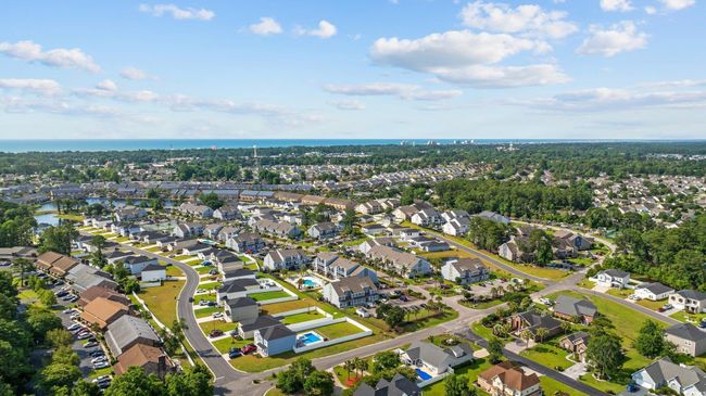 Aerial view of property and surrounding area featuring nearby suburban area and a large body of water | Image 28