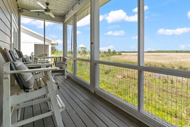 Sunroom featuring a ceiling fan | Image 28