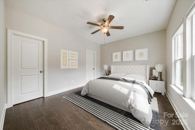 Large, second guest bedroom on the upper level with an en-suite bathroom and walk-in closet. Virtually staged | Image 26