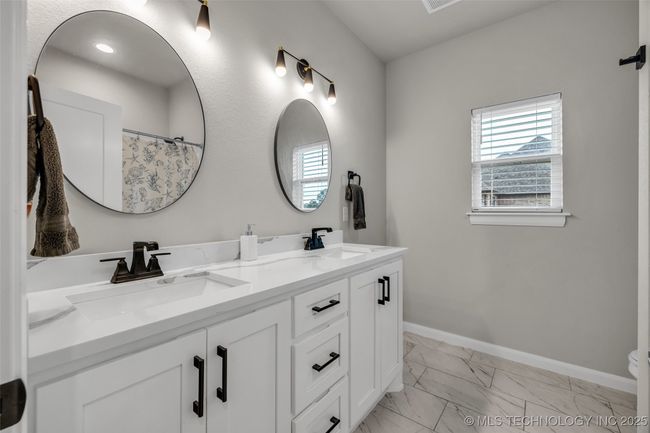 Guest bathroom with double sinks | Image 21