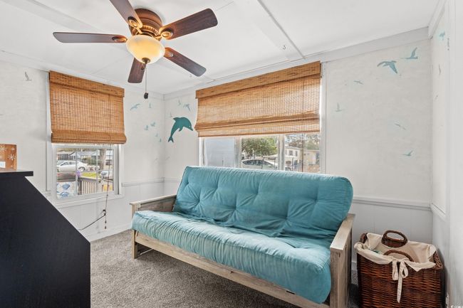 Sitting room featuring carpet, ceiling fan, and a healthy amount of sunlight | Image 24