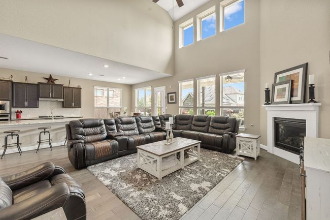 Living room with abundance of natural light and view of the kitchen and breakfast area | Image 14