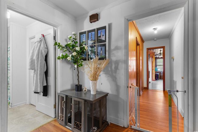 Corridor featuring ornamental molding and wood finished floors | Image 26