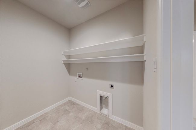 Laundry area featuring electric dryer hookup, hookup for a washing machine, hookup for a gas dryer, and baseboards | Image 34
