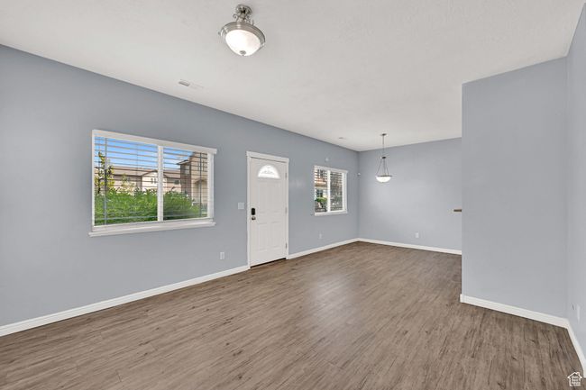 Foyer with baseboards and wood finished floors | Image 14