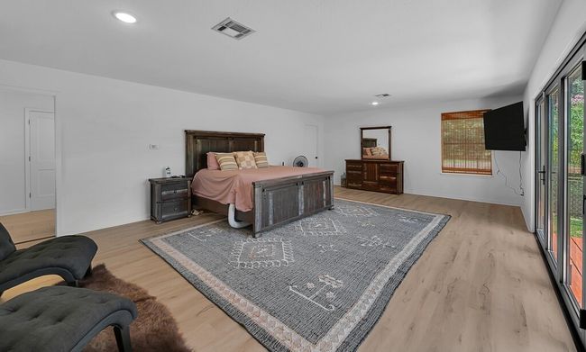 Bedroom featuring wood finished floors and recessed lighting | Image 14