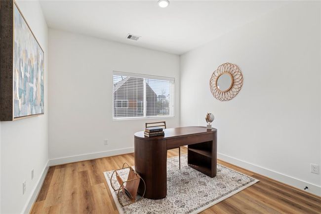 This multi-purpose secondary bedroom has been staged as an office to showcase it's versatility! | Image 26
