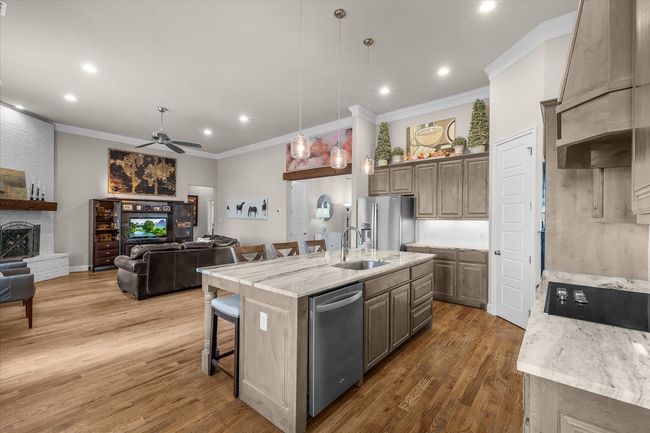 Kitchen opens to spacious living area | Image 12