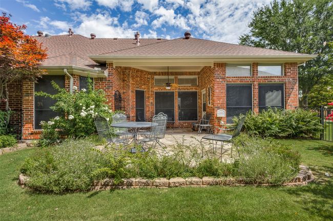 Rear view of property with a patio, brick siding, and a ceiling fan | Image 21