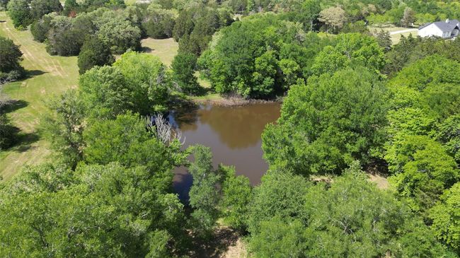 Bird's eye view featuring a wooded view and a water view | Image 12