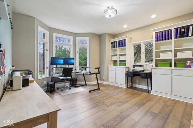 home office with wood-type flooring, baseboards, and recessed lighting | Image 24