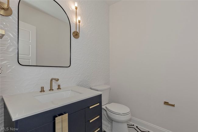 Bathroom featuring vanity and toilet | Image 29