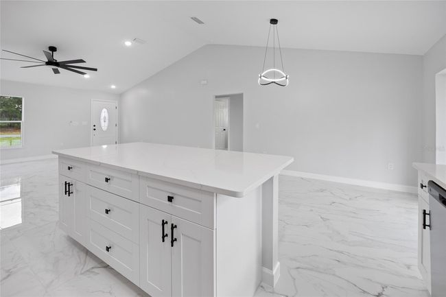 kitchen island and dining living room | Image 22