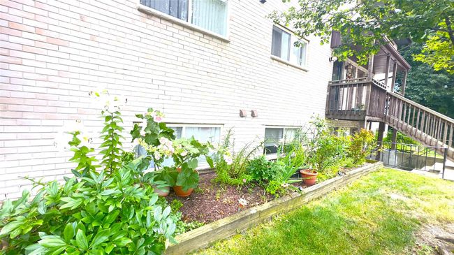 View of side of home with stairway and brick siding | Image 11