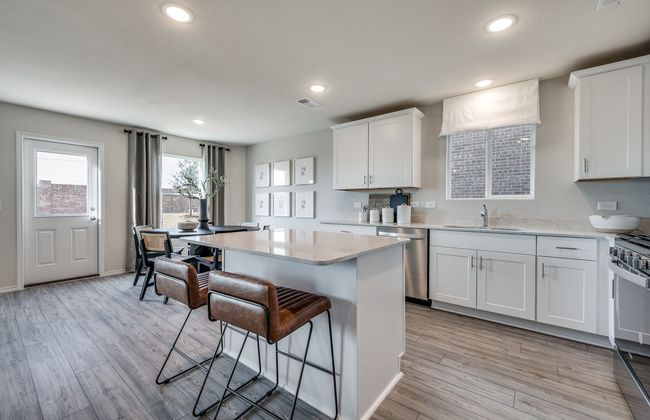 High-end gourmet kitchen with premium finishes and upgraded appliances *Model representation | Image 11