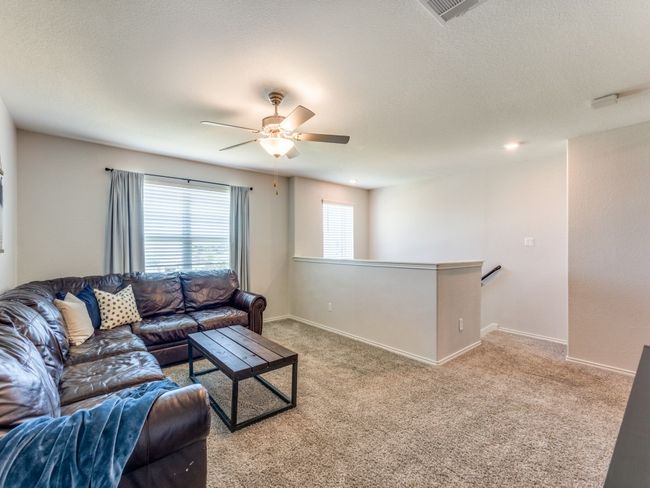 Living room with carpet and ceiling fan | Image 24