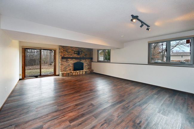 Freshly Painted Walk-Out Amusement/Family Room on 3rd Features Gas Fireplace and New LVP Flooring! | Image 27