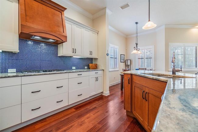 More than ample cabinets and stone countertops | Image 6