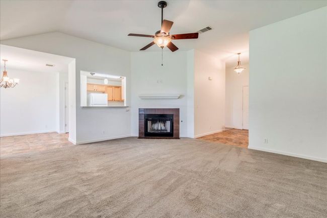 Living room featuring gas fireplace | Image 11