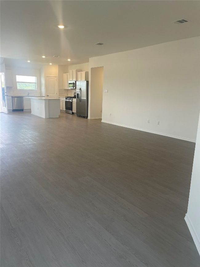 Unfurnished living room with recessed lighting, baseboards, and LVP flooring | Image 5