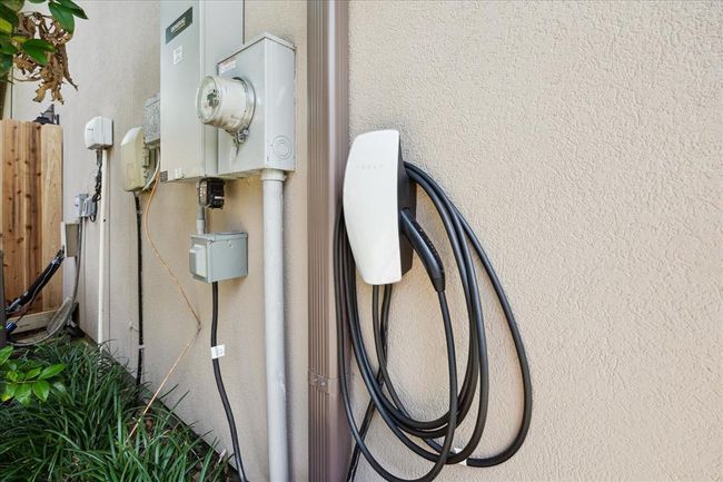 Outside The Third Car Garage Is The EV/Tesla Charger. Also, this Garage is Insulated and Is On AN A/C Split To Protect Your Prized Vehicle. | Image 48
