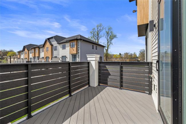 Wooden terrace with a residential view | Image 36