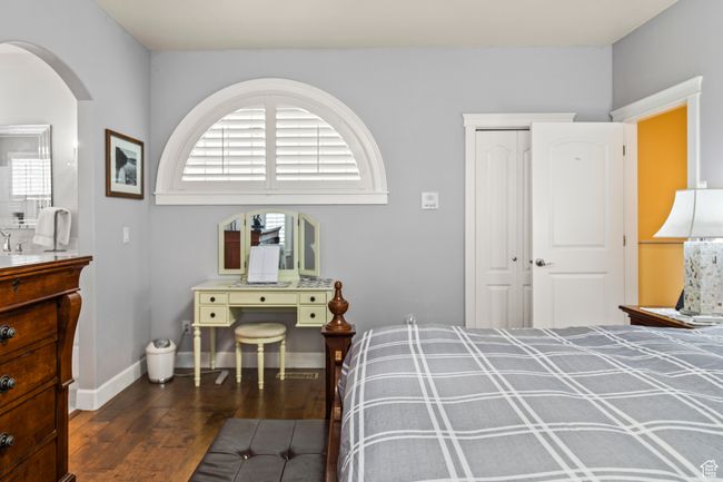 Bedroom featuring dark wood-type flooring and a closet | Image 45