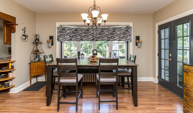 french doors go into sunroom | Image 35